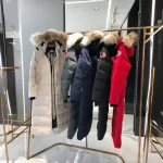 Canada Goose women's extra-long hooded coat in off-white - Image 7